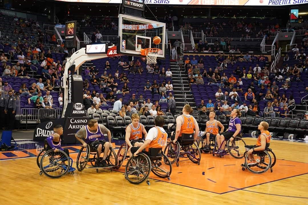 People playing wheelchair basketball at the Phoenix Suns arena