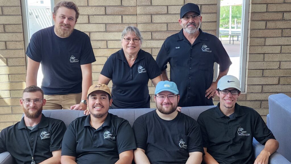 Several members of the Life Quest team, all wearing shirts with the Life Quest logo.